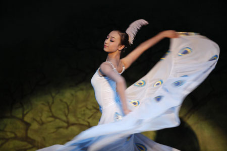 China - ch.A dancer of the Jiangsu Art Group of China performs the Peacock Dance.jpg